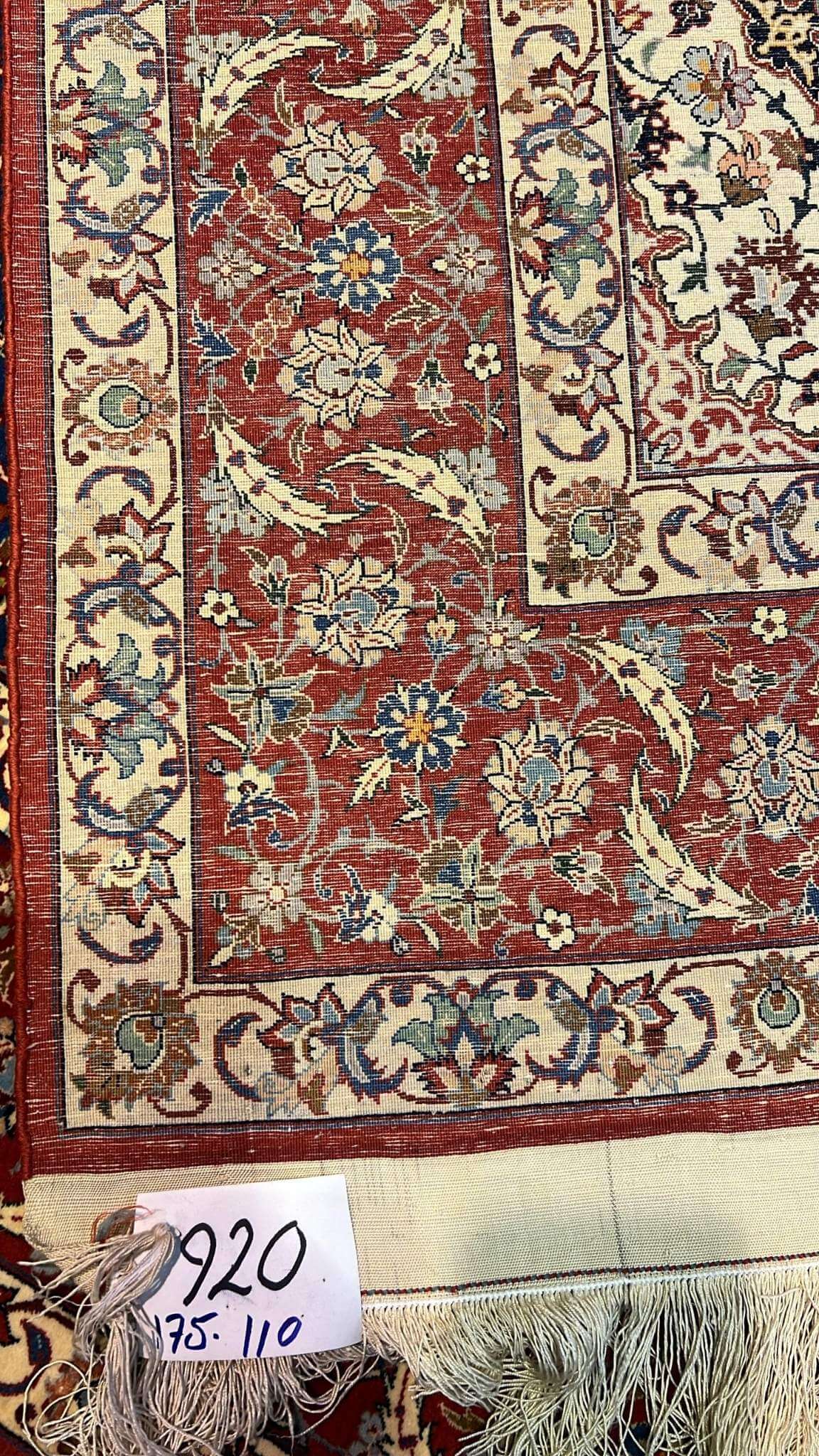 "Backside of the vintage Sadegh Seirafian Persian rug, revealing fine hand-knotted craftsmanship with silk warp."
